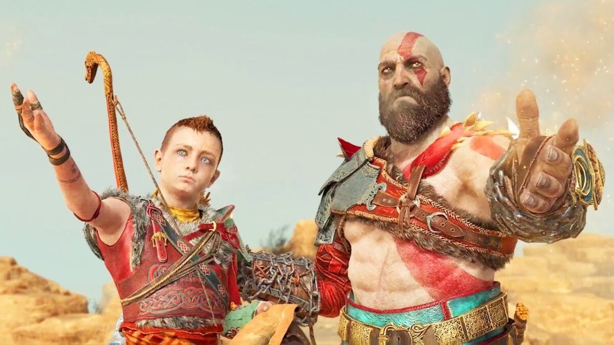 Kratos e Atreus no pico dourado de Jötunheim, olhando para o mural de profecias esculpido na rocha que revela a história de Laufey.